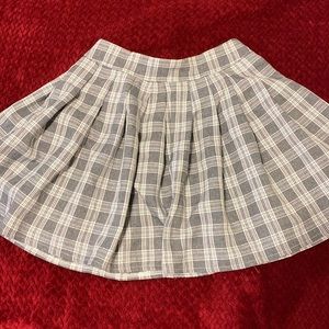 Pleated white and grey checkered skirt